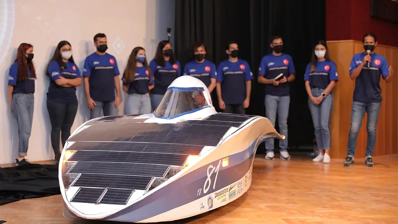 Students presenting a solar-powered vehicle